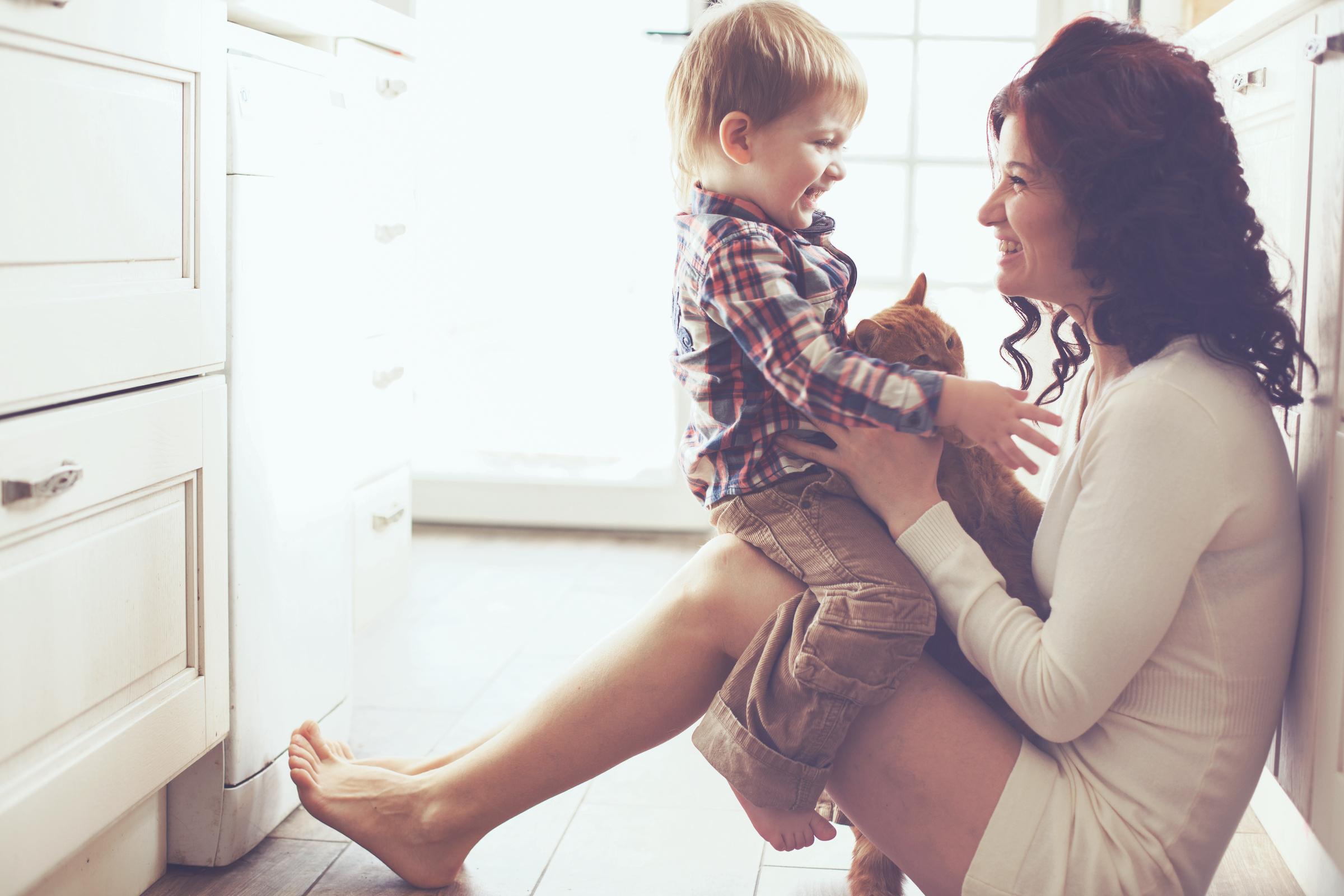 Mother,With,Her,Baby,Playing,With,Pet,On,The,Floor